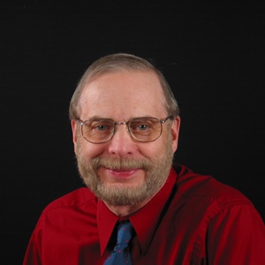 Charles Legg ran for Village Councilman in 2012 and this was my official picture were I am wearing my bright red shirt, blue tie, and full beard and mustache.