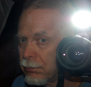 Charles Legg returned to his roots of photography in 2011 after purchasing a new Nikon camera and sporting a white goatee and mustache.