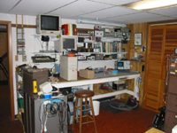 A wide electronics workbench about sever feet long which provides an anti-static environment for repairing computers and other electronics using common electronic test equipment and small hand tools.